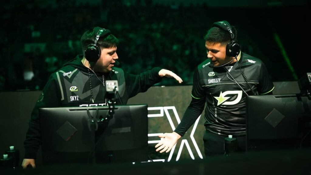 Image of OpTic Texas players Shotzzy and Sky high-fiving while standing on stage